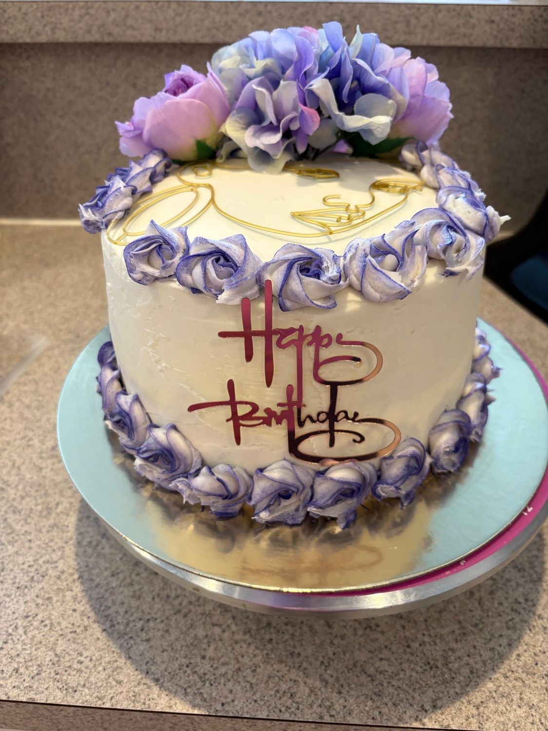 Birthday cake with purple hydrangea flowers