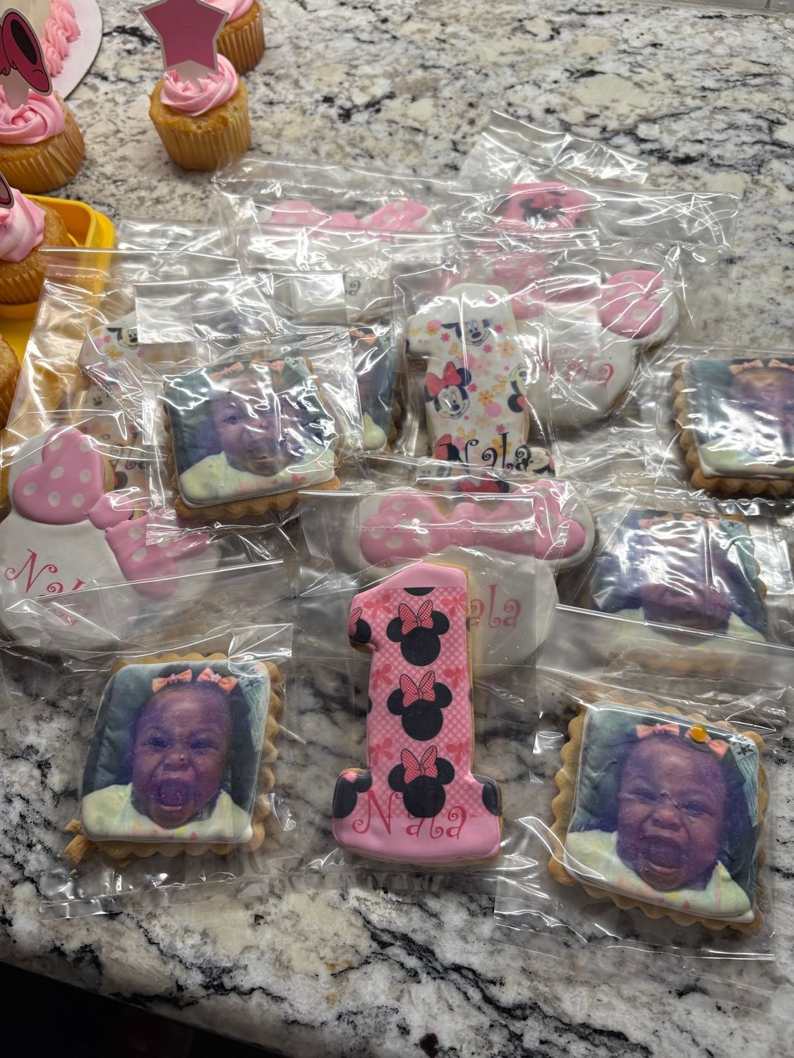 Minnie Mouse themed cookies and cupcakes