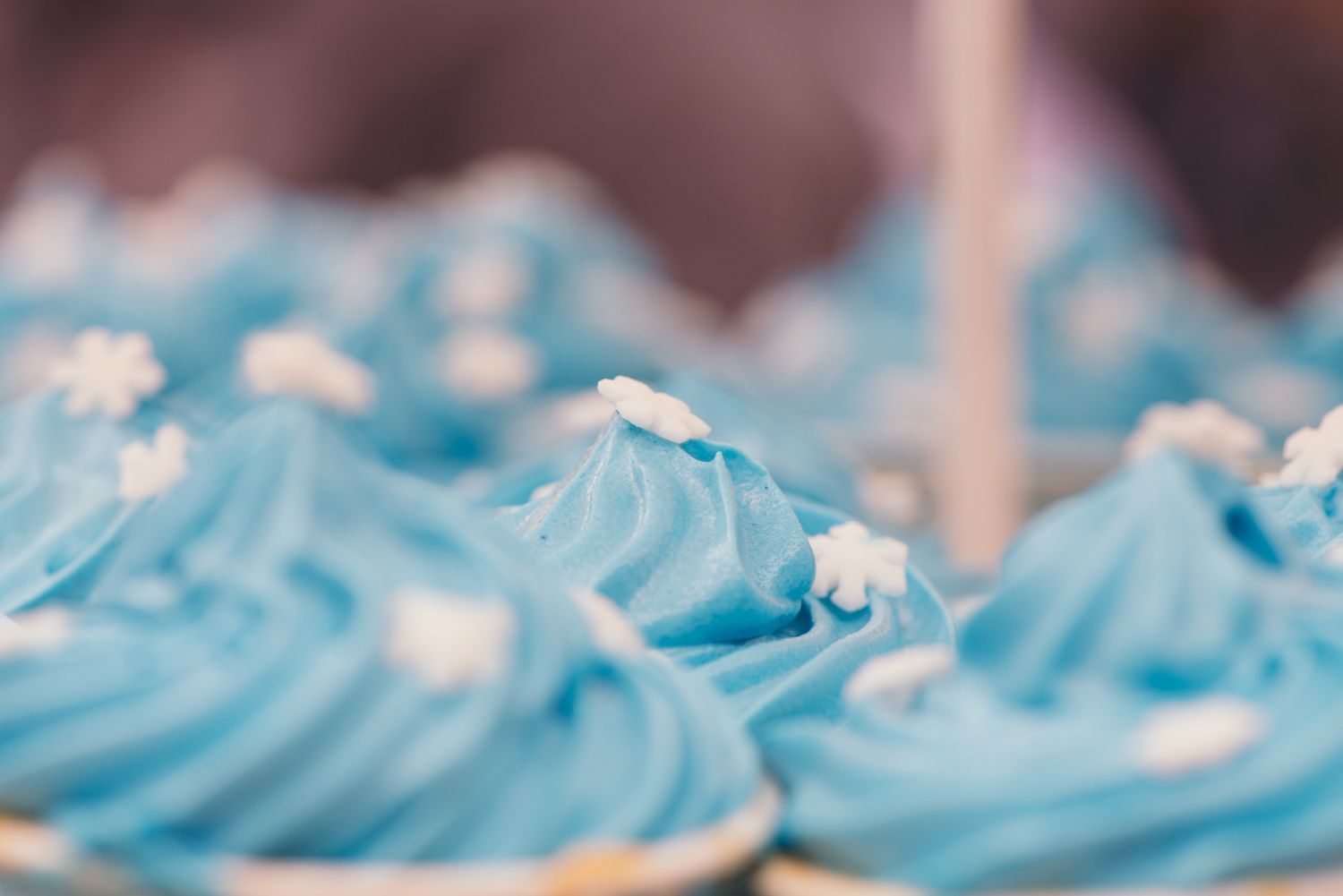 Cupcakes with blue frosting close up bokeh